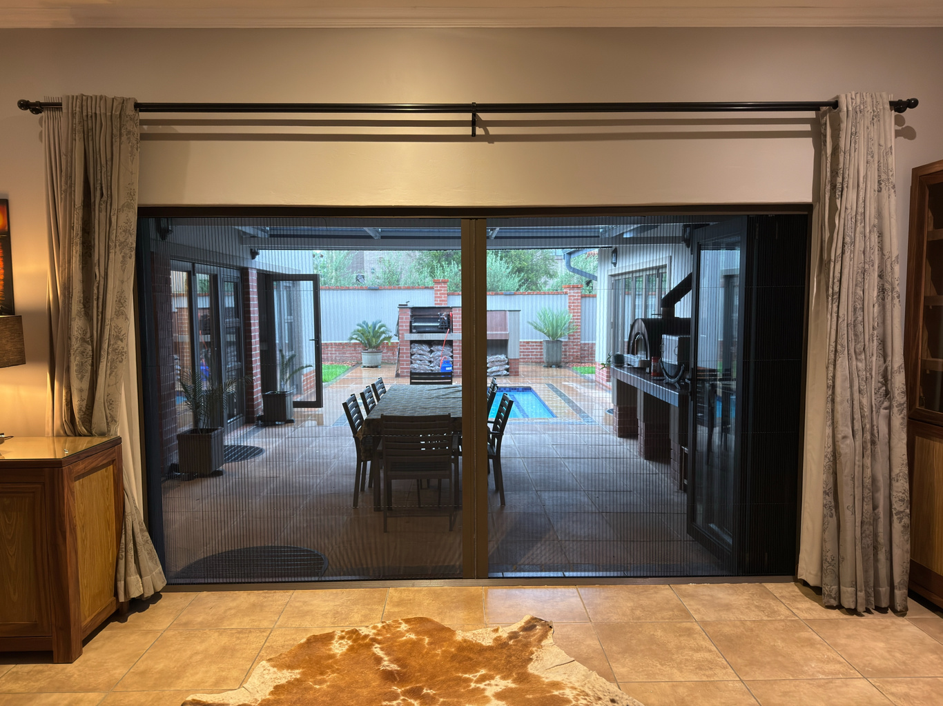 Retractable insect screen on a patio sliding door.