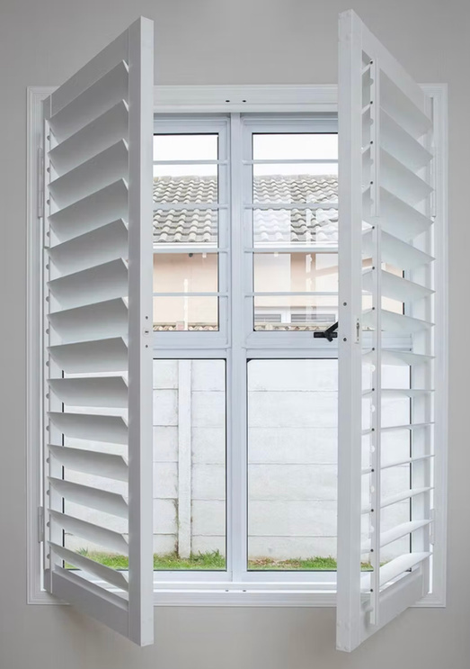 Close-up of white adjustable shutter louvres.