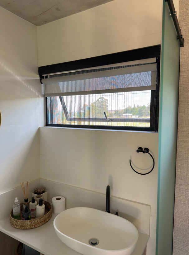 Insect screen installed on a bathroom window.
